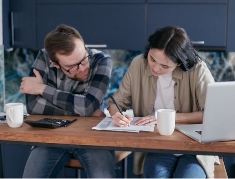 excited couple filling out playground frnachise inquiry